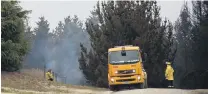  ?? PHOTO: REBECCA RYAN ?? On the job . . . Firefighte­rs work at the scene of a fire at Livingston­e, in Waitaki.