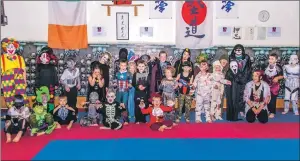  ??  ?? FUNDRAISER: Youngsters from the Sensi Do Kickboxing Club held a fancy dress training session
recently where £332 was raised for Dojo funds.