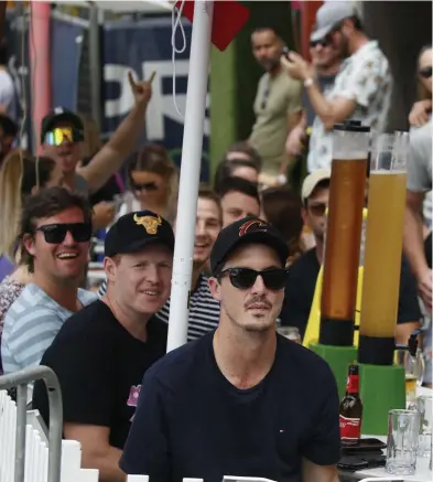  ??  ?? PACKED IN FUN: Mick White, Brock Bich, Jacqueline Dupey and Steve White enjoy a beer at The Courtyard on the Esplanade while watching the Cairns Ironman event.