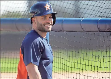  ?? File, Jeff Roberson / AP ?? Houston Astros infielder Jose Altuve smiles during spring training baseball practice in West Palm Beach, Fla.