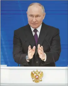  ?? AP Photo / Alexander Zemlianich­enko ?? Russian President Vladimir Putin delivers his state-of-the-nation address in Moscow, Russia on Thursday.