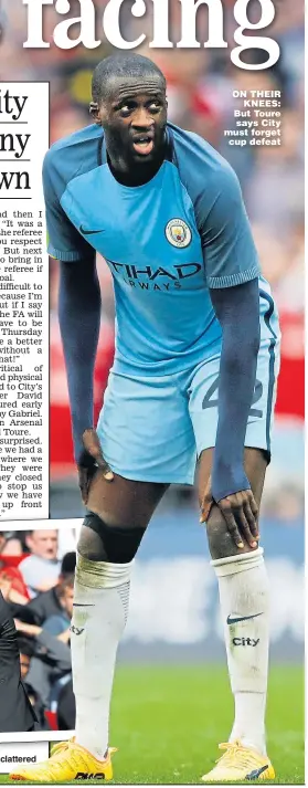 ??  ?? ON THEIR KNEES: But Toure says City must forget cup defeat