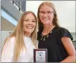  ?? ?? Annette Beard/Pea Ridge TIMES The Lady Blackhawk Golden Glove outfield award was presented to Hailee Willey, shown with assistant coach Elzie Yoder.