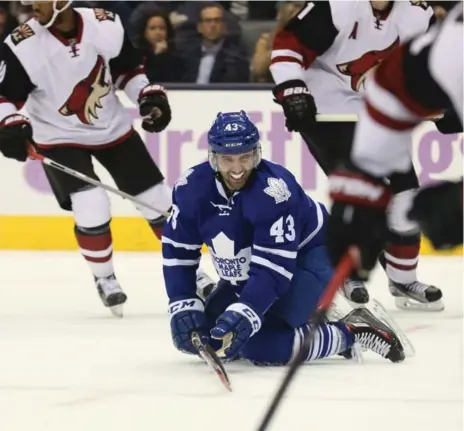  ?? RICK MADONIK/TORONTO STAR ?? Maple Leafs centre Nazem Kadri hits the ice after being slashed by an Arizona Coyote during first-period action on Monday night at the ACC.