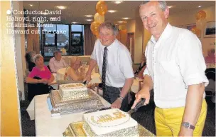  ?? Conductor David Holroyd, right, and Chairman Kevin Howard cut the cake ??