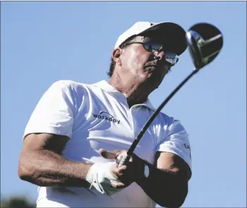  ?? AP PHOTO/ROSS D. FRANKLIN ?? Phil Mickelson watches his tee shot on the first hole during the third round of the Charles Schwab Cup Championsh­ip golf tournament on Saturday in Phoenix.