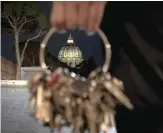  ?? PHOTO BY TIZIANA FABI / AFP ?? n The cuppola of St.Peter’s basilica seen through the ring of a big mast of keys.