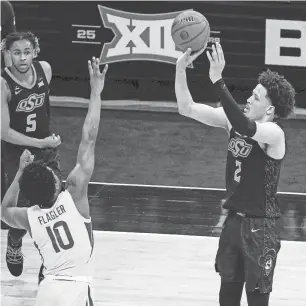  ?? JAY BIGGERSTAF­F/USA TODAY SPORTS ?? If the Pistons were to win the lottery, Cade Cunningham, right, would instantly become Detroit’s most talented draft pick since Grant Hill.