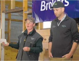  ??  ?? Kit Holmes, winning the Tararua Shepherd of the Year, presented by inaugural winner in 2013 Mark Heaphy. Mark manages ADB Williams Trust, the competitio­n’s main sponsor and runs an on-farm cadetship.