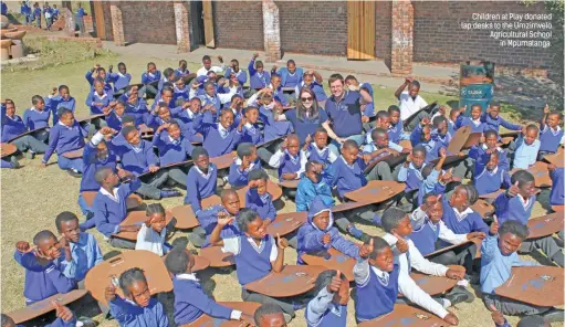  ??  ?? Children at Play donated lap desks to the Umzimvelo Agricultur­al School in Mpumalanga.