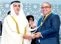  ??  ?? Shaikh Saif bin Zayed Al Nahyan presenting the Sheikh Khalifa Excellence Award to Dr Shabeer Nellikode.