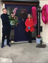  ??  ?? Ciaran brings a bouquet of flowers to Helen from her son, who was unable to come home from London for the occasion.