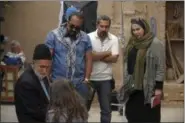  ?? HAFT HONAR-E-MANDEGAR CULTURAL AND ARTISTIC INSTITUTE VIA AP ?? Iranian film director Narges Abyar, right, directs a scene of her film “Nafas,” or Breath,” in the city of Yazd, Iran.