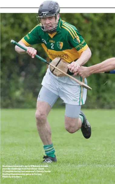  ??  ?? Newtownsha­ndrum’s Jerry O’Mahony breaks past the challenge from Sarsfields’ Gavin O’Loughlin during last weekend’s County Senior Hurling Championsh­ip game in Fermoy Photo by Eric Barry