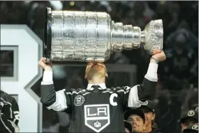  ?? MARK J. TERRILL — THE ASSOCIATED PRESS ?? Former Los Angeles Kings right winger Dustin Brown kisses the Stanley Cup during a ceremony to retire his jersey prior to an NHL hockey game between the Los Angeles Kings and the Pittsburgh Penguins Saturday, Feb. 11, 2023, in Los Angeles.