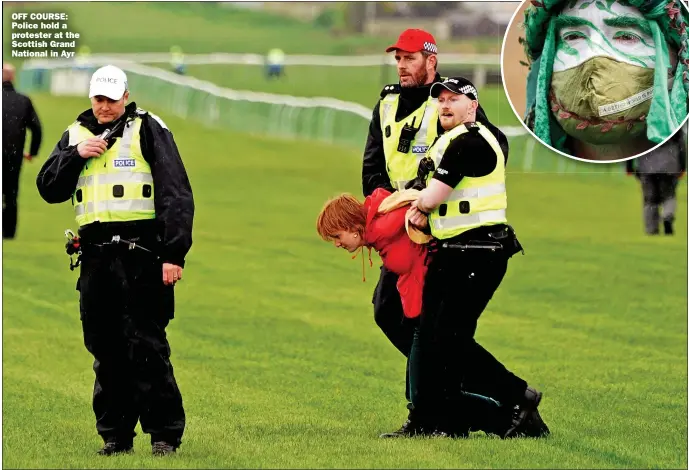  ?? Picture: JANE BARLOW/PA ?? OFF COURSE: Police hold a protester at the Scottish Grand National in Ayr