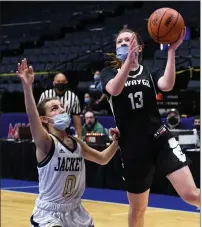  ?? DREW ELLIS — MEDIANEWS GROUP ?? Newaygo’s Jaxi Long (13) puts up a shot over Detroit Country Day’s Victoria Miller (0) during Wednesday’s Division 2 girls basketball semifinal at Van Andel Arena in Grand Rapids. Long had 12 points to help the Lions to a 55-39 win over the Yellowjack­ets.