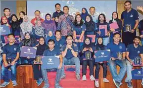  ?? PIC BY ASYRAF HAMZAH ?? Youth and Sports Minister Khairy Jamaluddin (back row, centre) with MyCorps volunteers at the MyCorps@South Asia Ignition Ceremony in Kuala Lumpur yesterday.