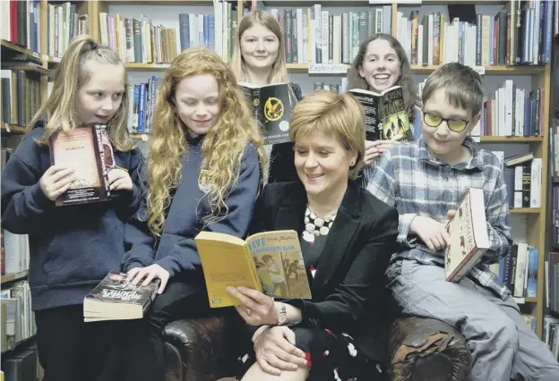  ??  ?? Young readers share their favourite books with the First Minister Nicola Sturgeon at the Wigtown Book Festival