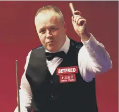  ??  ?? 0 John Higgins celebrates after defeating Thepchaiya Un-nooh.