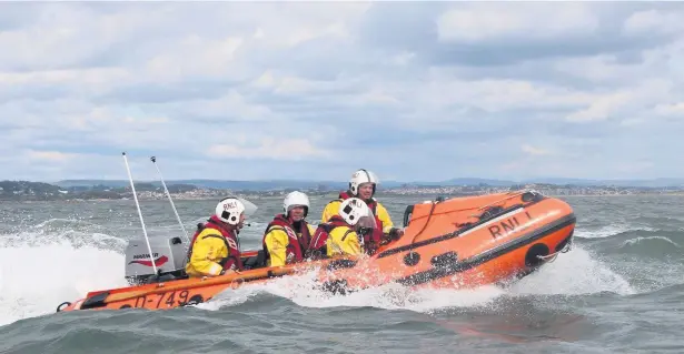  ?? Pictures: Burry Port RNLI and crew members ?? The Burry Port crew out on the waves.