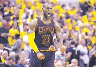  ?? Michael Conroy / Associated Press ?? LeBron James’ triple-double of 41 points, 13 rebounds and 12 assists carried Cleveland back from 25 down at halftime against the Pacers. It is the third-largest comeback in playoff history.