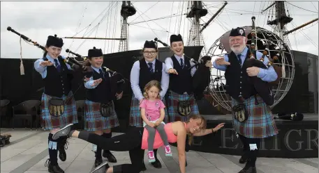  ??  ?? Pipe band members Blaithnaid Doyle, Jodi Fanthom, Alex Walsh, Jane Sutton and Brian McMahon with Cara McGrath and Rhea Dillon.