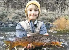  ?? COURTESY PHOTO ?? Marcelo Richert, 9, of Arroyo Hondo caught a 16-inch brown trout using a Rapala lure on the Río Grande on Nov. 3.