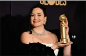  ?? ROBYN BECK — AFP VIA GETTY IMAGES ?? Lily Gladstone poses with the award for best performanc­e by a female actor in a motion picture — drama for “Killers of the Flower Moon” in the media room during the 81st annual Golden Globe Awards in Beverly Hills on Jan. 7.