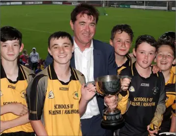  ??  ?? Kilrush joint captains Danny Ascott and Adam O’Donoghue collecting the cup from Jim Dempsey.