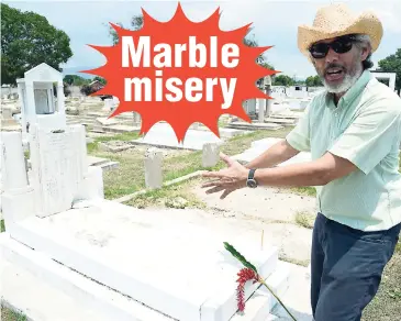  ?? RICARDO MAKYN/MULTIMEDIA PHOTO EDITOR ?? Vincent Chang, supervisor of the Board of Directors of the Chinese Benevolent Associatio­n of Jamaica, points out the damage to the headstones and the graves at the Chinese Cemetery in Kingston, yesterday, during the associatio­n’s celebratio­n of the...