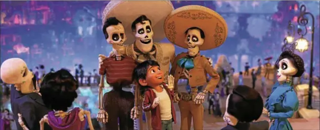  ?? DISNEY-PIXAR ?? Young Miguel, voiced by Anthony Gonzalez, meets his idol, Ernesto de la Cruz, voiced by Benjamin Bratt, in the land of the dead in “Coco.”