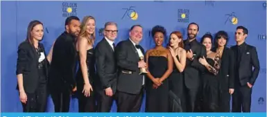  ??  ?? The cast of “The Handmaid’s Tale” pose with the trophy for Best Television Series - Drama during the 75th Golden Globe Awards.