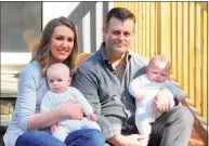  ?? Christian Abraham / Hearst Connecticu­t Media ?? Elizabeth and Chris Tillett pose with their twin sons John and Luke, at right, at their home in Wilton on March 26. Chris was one of the first coronaviru­s patients in Connecticu­t.