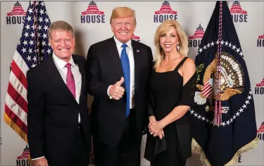  ?? Contribute­d Photo ?? Dinner with the president: John Sinclair (right) and his wife Tasha (left) pose for a photo with President Donald Trump at the Trump Internatio­nal Hotel. The couple was invited to have dinner with the president in late September.