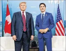  ?? AP PHOTO ?? U.S. President Donald Trump meets with Prime Minister Justin Trudeau at the G7 summit in Charlevoix on June 8.