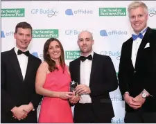  ??  ?? Dr Anna Foy and Dr Peter Kelly accept the award for Establishi­ng GP of the Year, presented by Joe Newell, CEO, GPBuddy.ie and Bill Coghlan, Med Café.