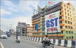  ?? PTI PHOTO ?? A GST poster on a building in Guwahati on Friday.
