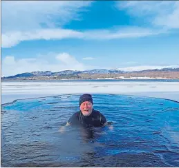  ??  ?? Nick Drainey enjoys a dip in chilly Loch Insh