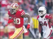  ?? THEARON W. HENDERSON — GETTY IMAGES, FILE ?? Jeff Wilson Jr. rushes past the Cardinals’ Jalen Thompson en route to a touchdown during the second half at Levi’s Stadium in Santa Clara in November 2019.