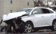  ?? PETE BANNAN - DIGITAL FIRST MEDIA ?? This Lexus SUV collided with a tractor-trailer that overturned on Baltimore Pike in Pennsbury.