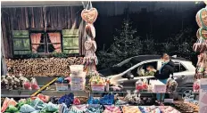  ??  ?? Christmas market in Landshut, Germany. Below: Lincolnshi­re goat farmer Sam Bertins with her take on a Scandinavi­an “Yule Goat”.