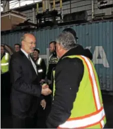  ?? LORETTA RODGERS — DIGITAL FIRST MEDIA ?? Gov. Tom Wolf greets workers after touring Penn Inc. in Eddystone on Friday. Terminals