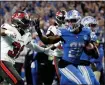  ?? ASSOCIATED PRESS FILE PHOTO ?? Detroit Lions running back Jahmyr Gibbs (26) rushes for a touchdown chased by Tampa Bay Buccaneers safety Antoine Winfield Jr. (31) in the second half during an NFL divisional round playoff game last month in Detroit.