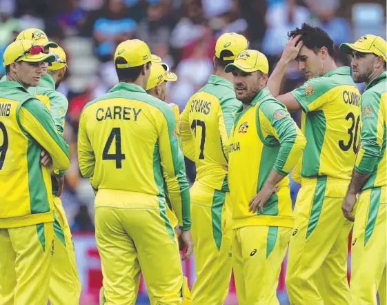  ?? Picture: AP PHOTO ?? Tough times in the middle as Australian captain Aaron Finch tries to rally his troops against England.