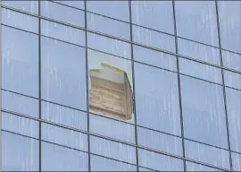  ?? Eduardo Contreras San Diego Union-Tribune ?? A DAMAGED glass panel on an upper f loor of the San Diego Central Courthouse. No one has been injured in three unexplaine­d breaks at the 22-story structure.