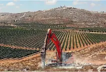  ?? PHOTO: REUTERS ?? Constructi­on work begins on Amichai, a new settlement which will house Jewish settlers evicted from the illegal West Bank settlement of Amona.