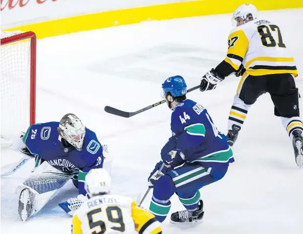  ?? — THE CANADIAN PRESS ?? The power trio of Sidney Crosby, pictured, Evgeni Malkin and Phil Kessel combined for all five goals in the Penguins’ 5-0 takedown of the Canucks Saturday at Rogers Arena.