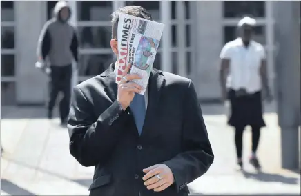  ?? PICTURE: ITUMELENG ENGLISH/AFRICAN NEWS AGENCY (ANA) ?? Former coach at Parktown Boys’ High, Rex Collins, covering his face after appearing at the Palm Ridge Magistrate’s Court. Collins is facing more than 300 charges of rape, sexual assault and attempted murder.