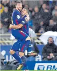  ?? AFP ?? Lionel Messi, left, and Luis Suarez.